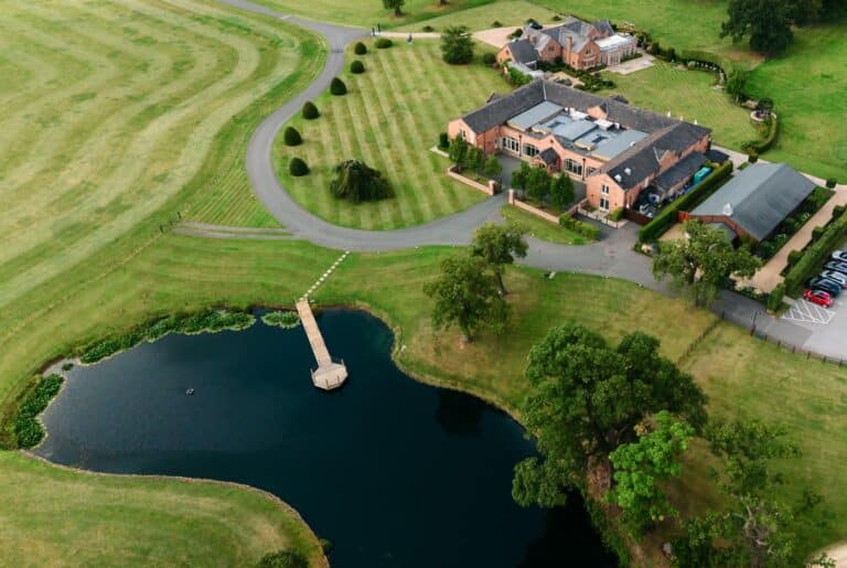 Aerial view of Merrydale Manor wedding venue with two lakes and parkland grounds