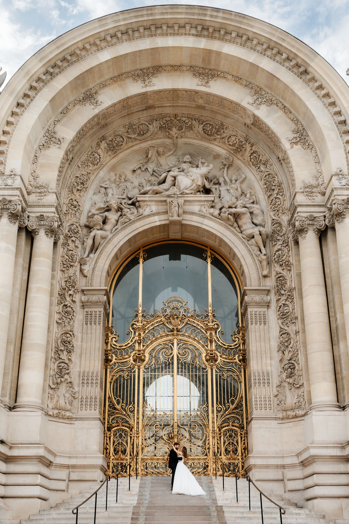 Bride and groom at the golden gates of Petit Palais, Paris