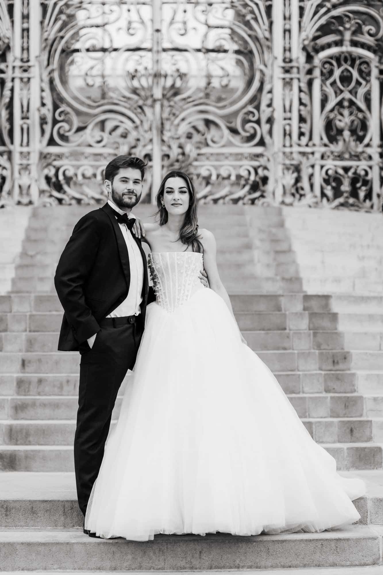 Bride and groom on the steps of Petit Palais, Paris