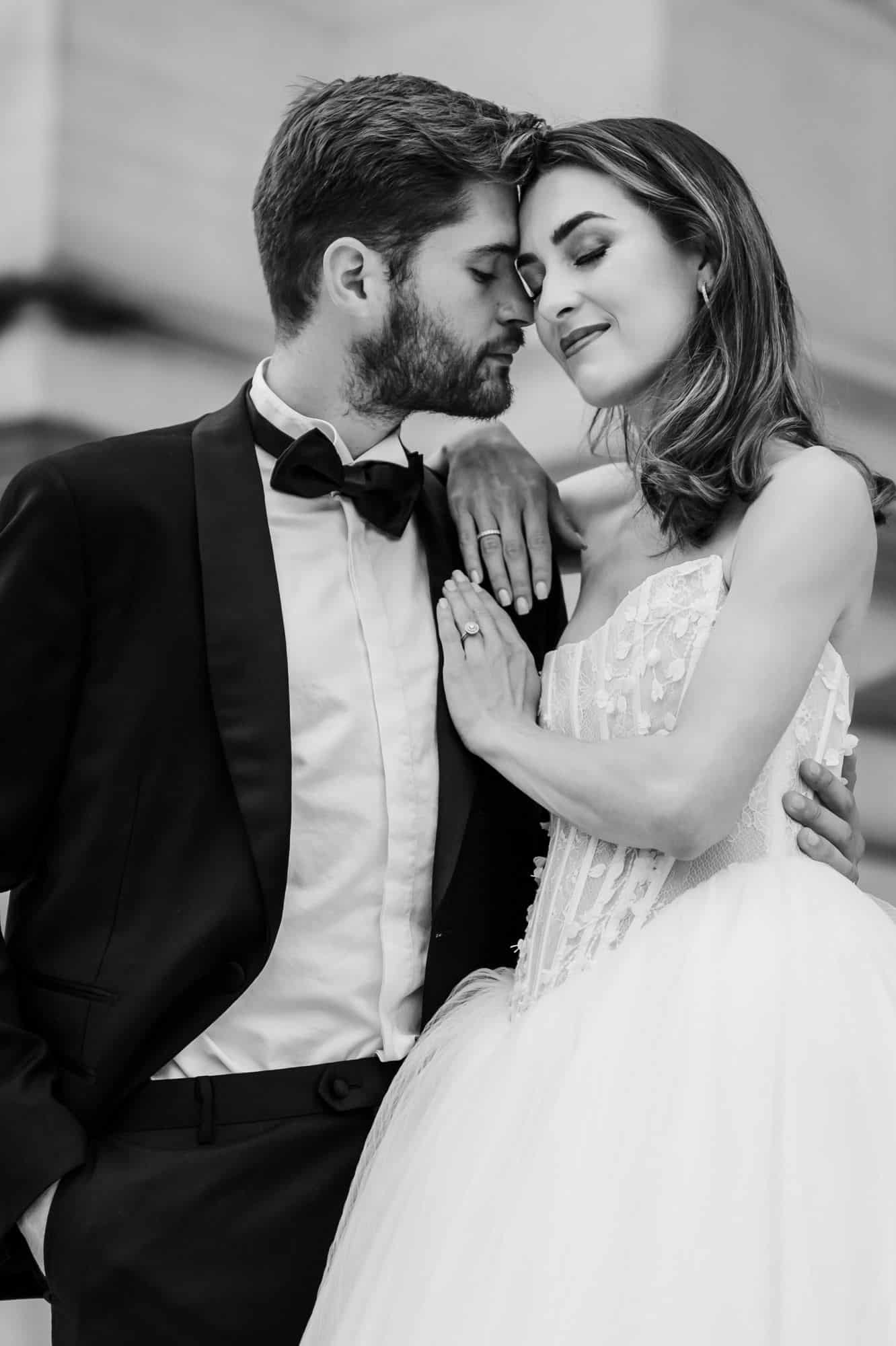 Bride and groom embracing at Petit Palais gate, Paris