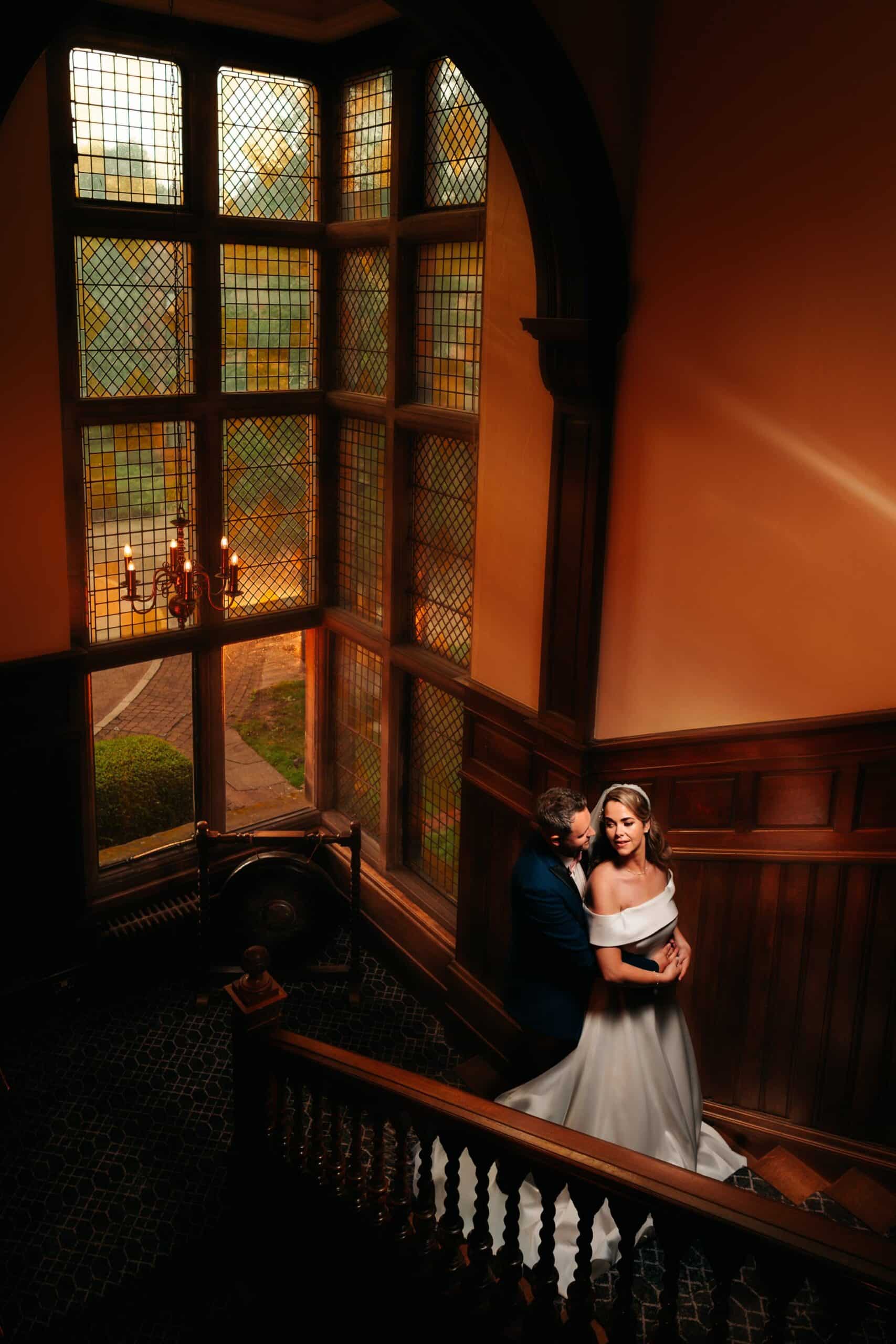 Staircase and stained glass window at Rookery Hall