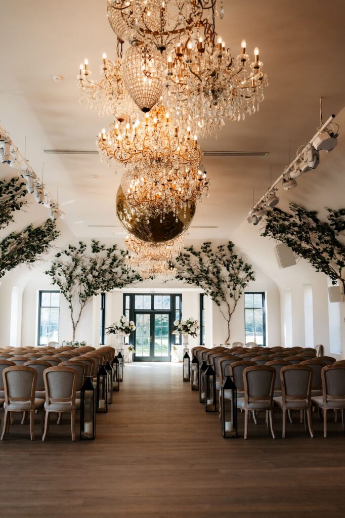 The Vinery dressed for a wedding ceremony with chandeliers