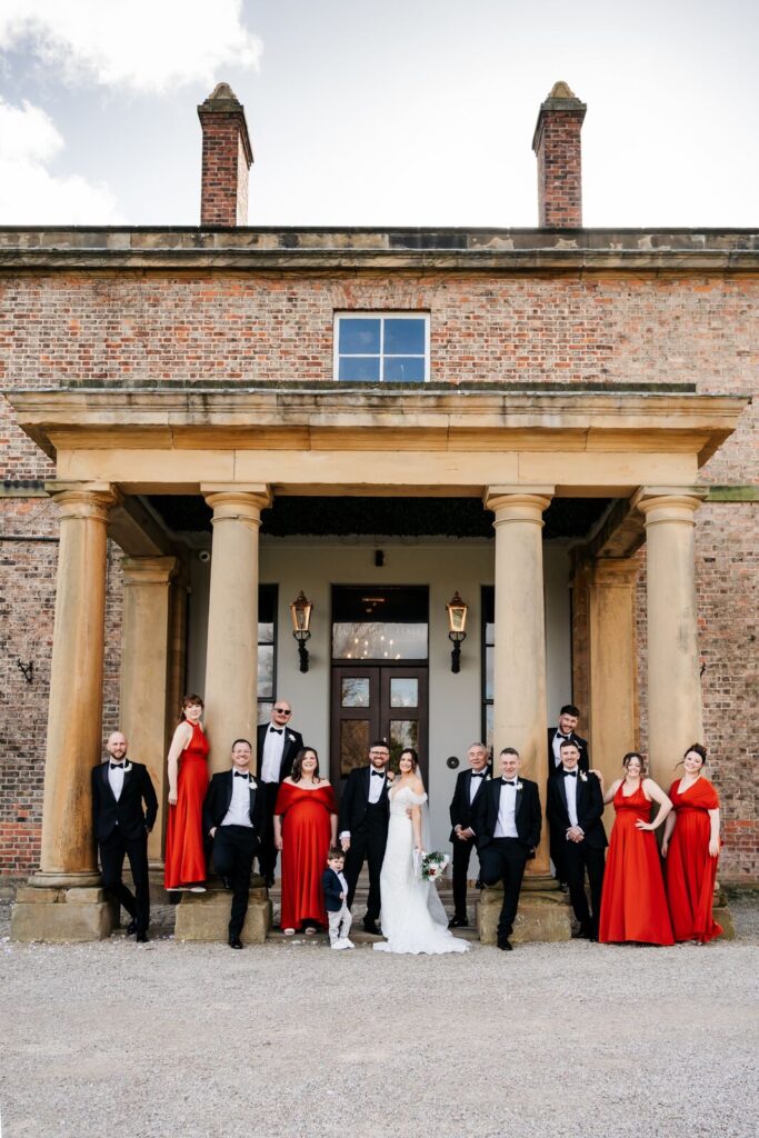 Wedding party on the steps of Solberge Hall, North Yorkshire