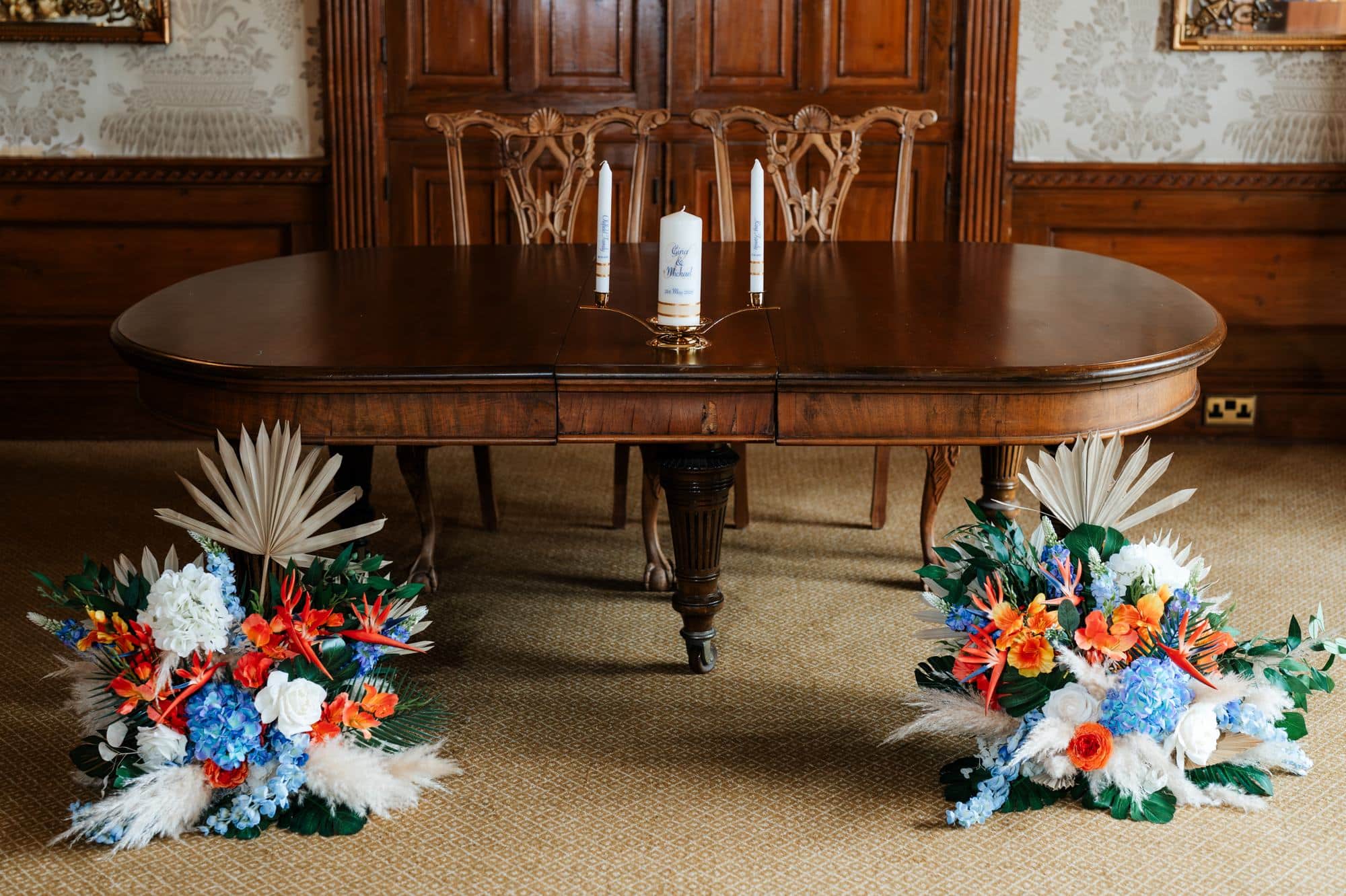 Ceremony room table with flowers at Goldsborough Hall wedding venue