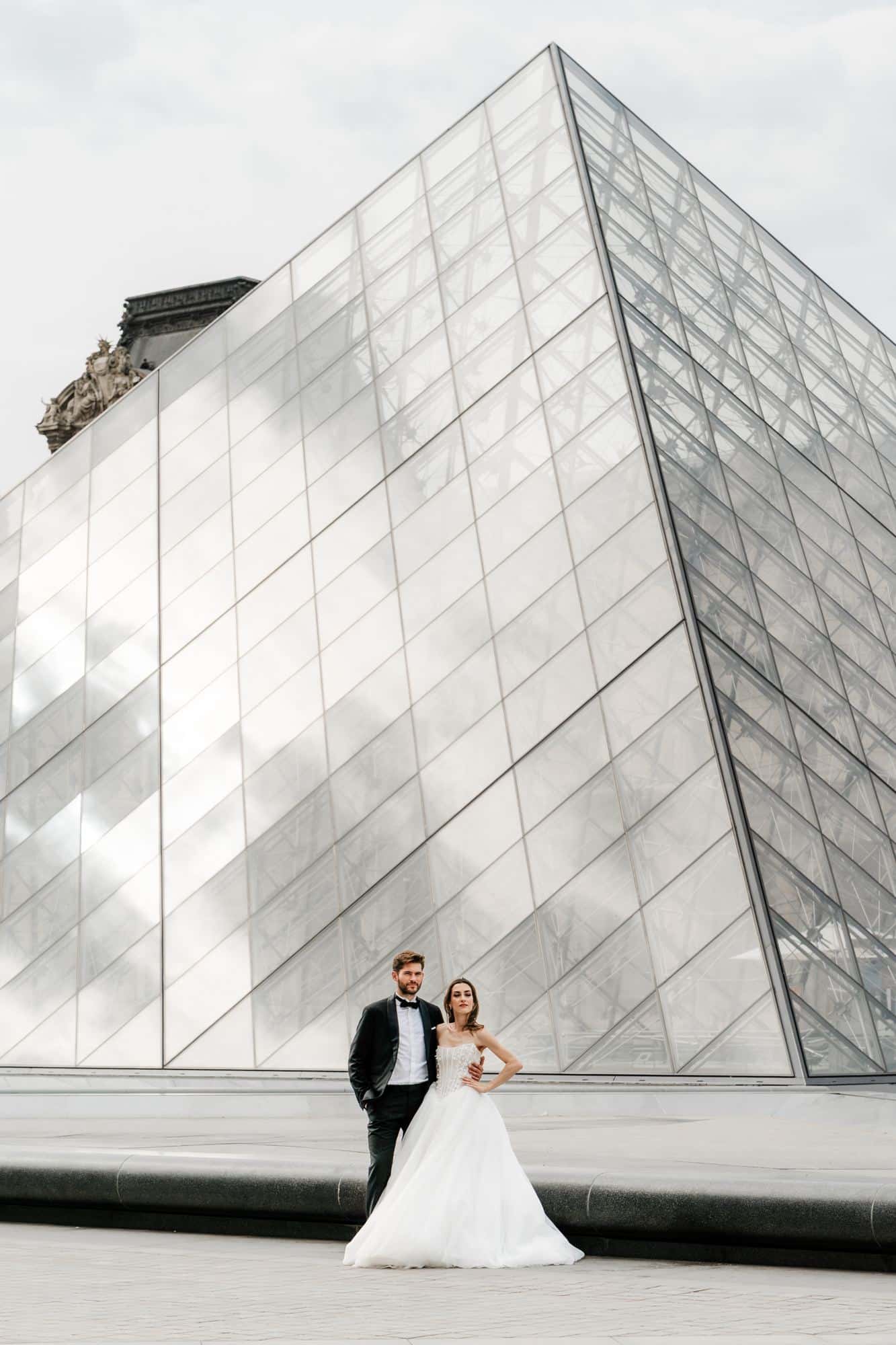 Bride and groom at the Louvre Pyramid, Paris