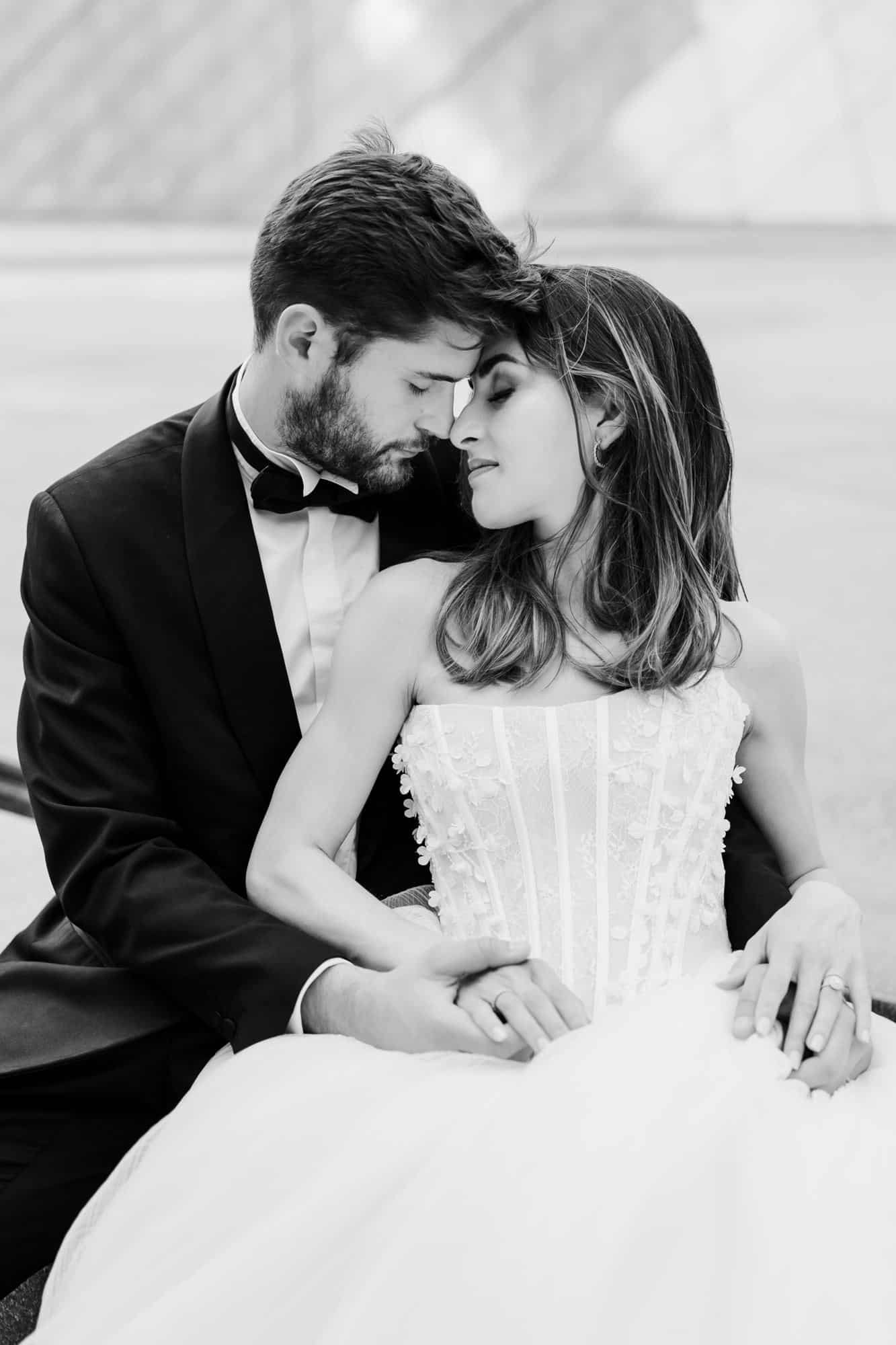 Bride and groom in the courtyard of the Louvre, Paris