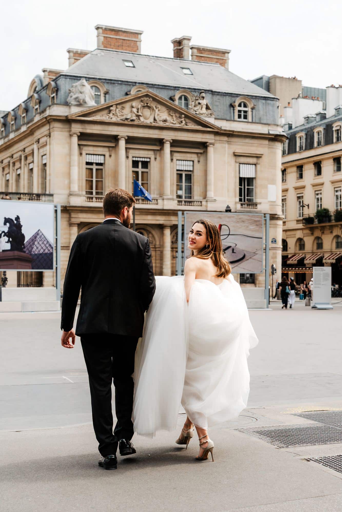 Bride and groom in the courtyard of Palais Royal, Paris